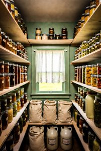 Hattie's Pantry filled with canning jars and feed sacks
