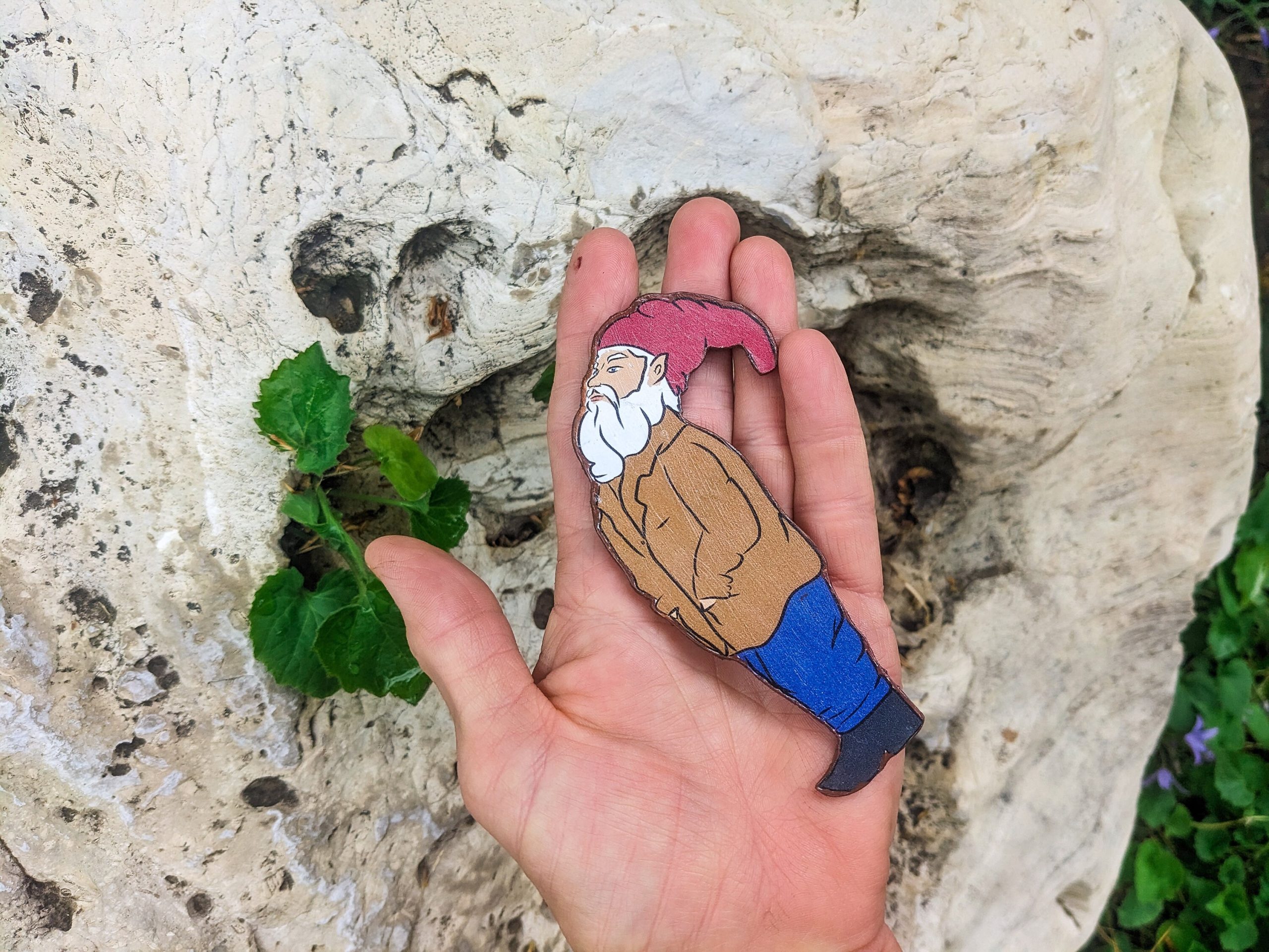Hand-cut wooden gnome magnet showing natural edge and grain — small handmade gift.