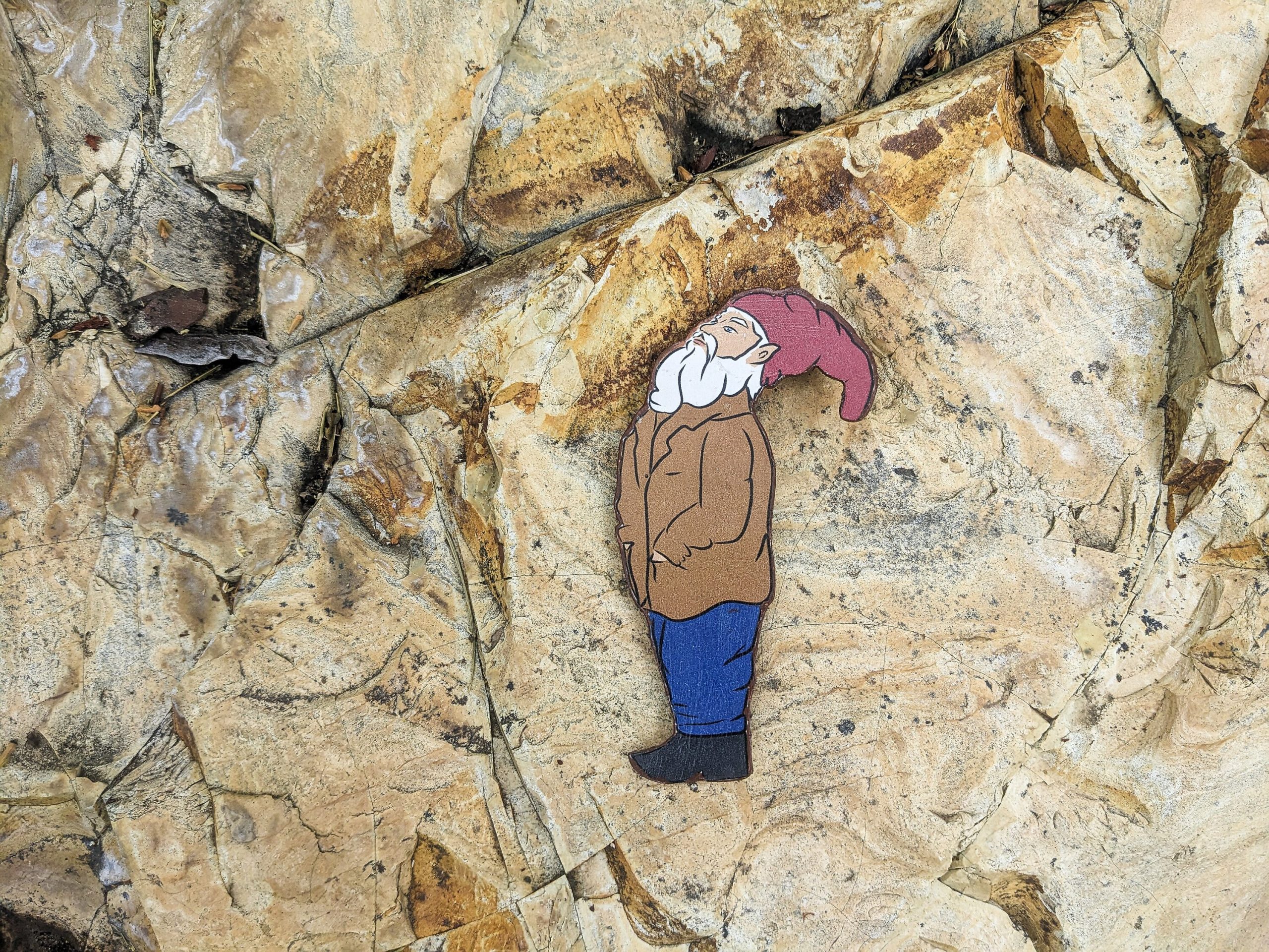 Whimsical wooden gnome magnet styled in kitchen setting — cottagecore fridge decor.