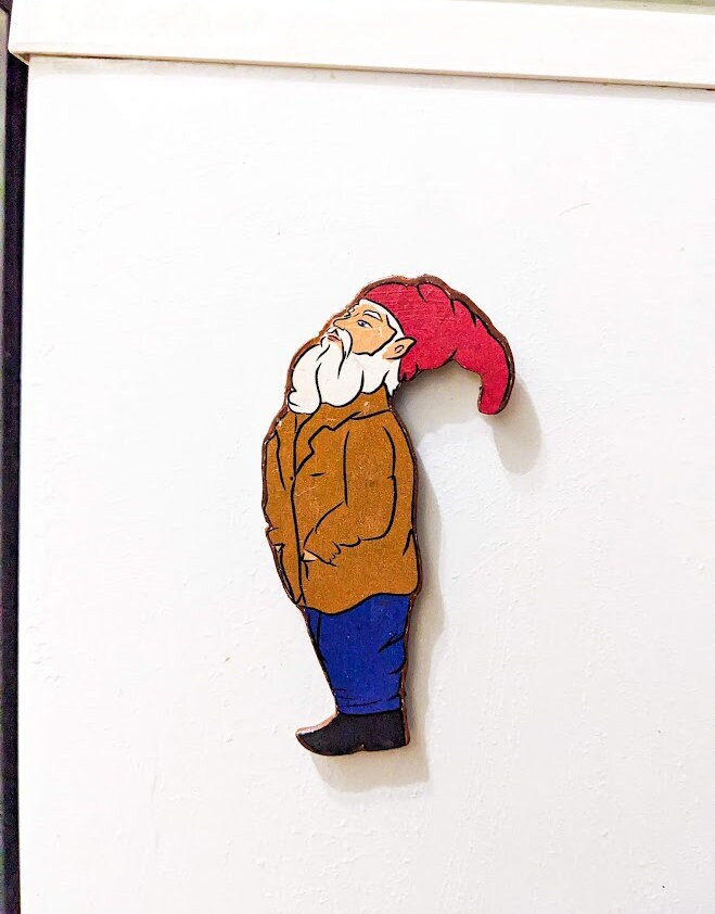Handcrafted wooden gnome magnet looking up — rustic refrigerator cutout for cottagecore kitchen decor.