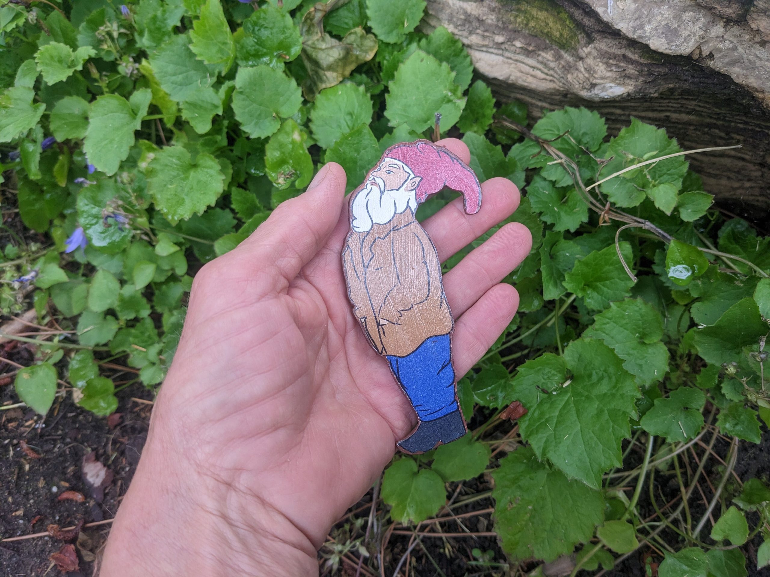 Wooden gnome looking up refrigerator magnet — Sprouted Dreams handcrafted home accent.