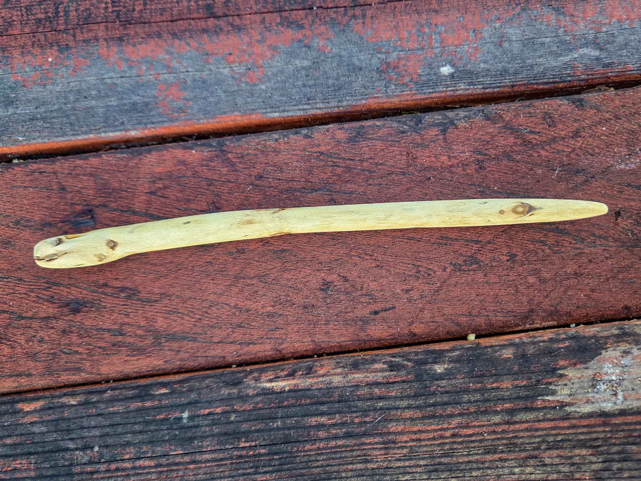 Cottonwood wood hair fork worn outdoors in natural light — sustainable beauty without plastic.