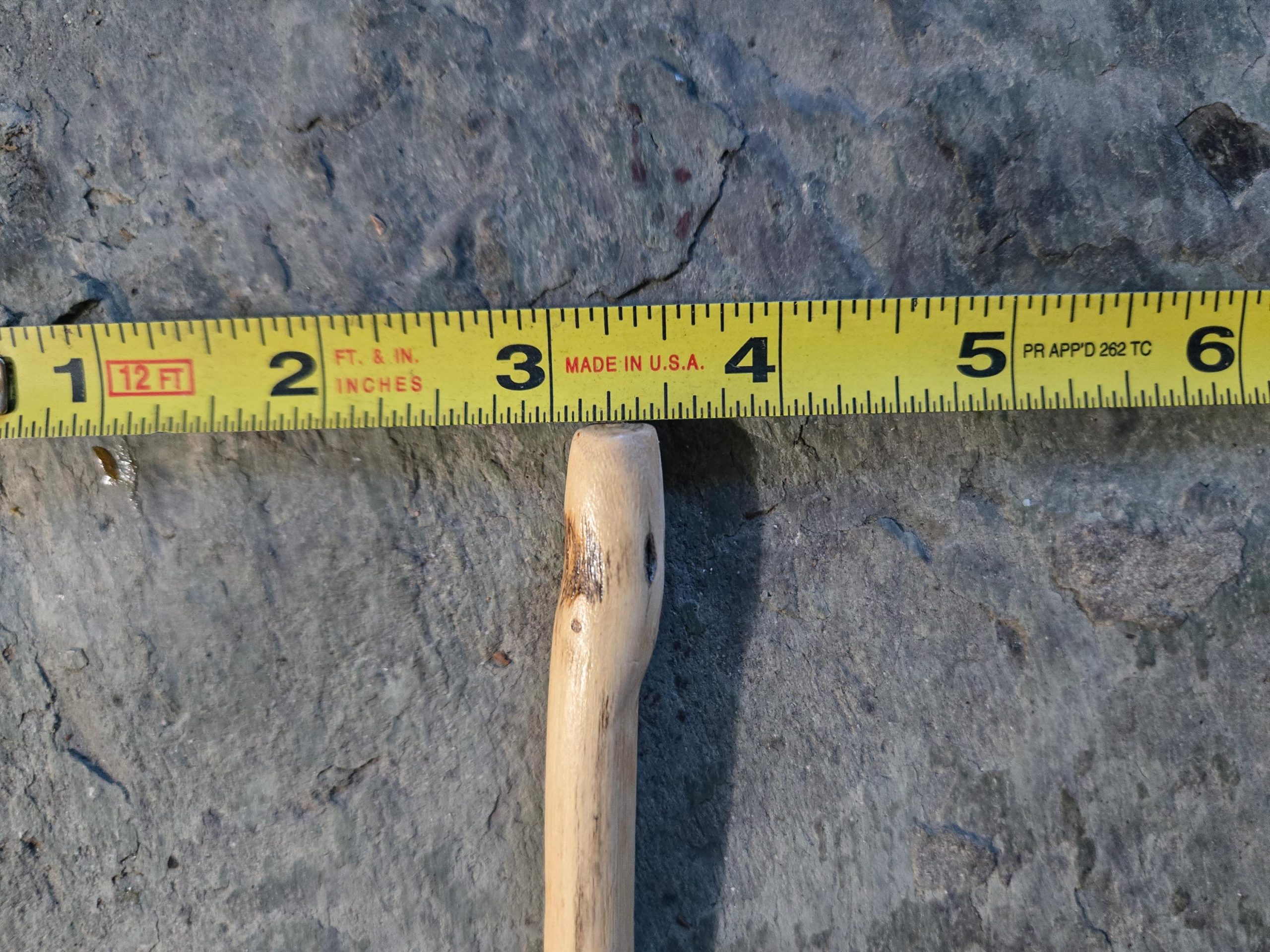 Cottonwood wood hair fork holding thick long hair from behind — durable handmade pin for boho styling.