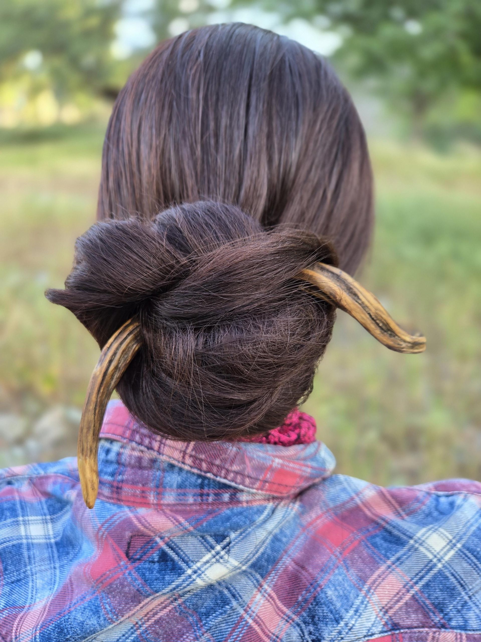 Handmade twisted wood hair fork styled in long hair — pin-up hair stick for everyday wear.