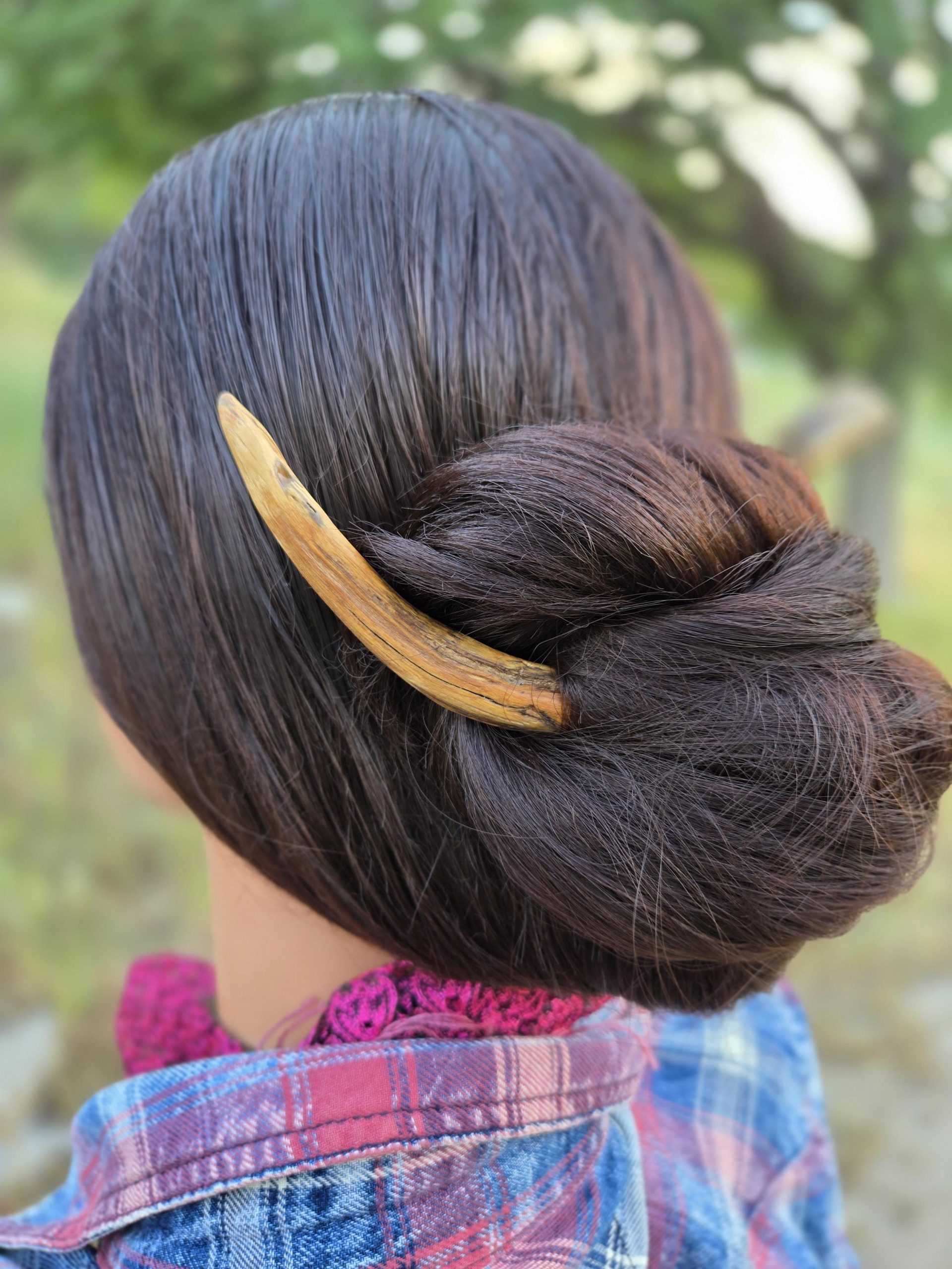 Alternate angle of twisted wood hair fork — Sprouted Dreams plastic-free hair accessory.